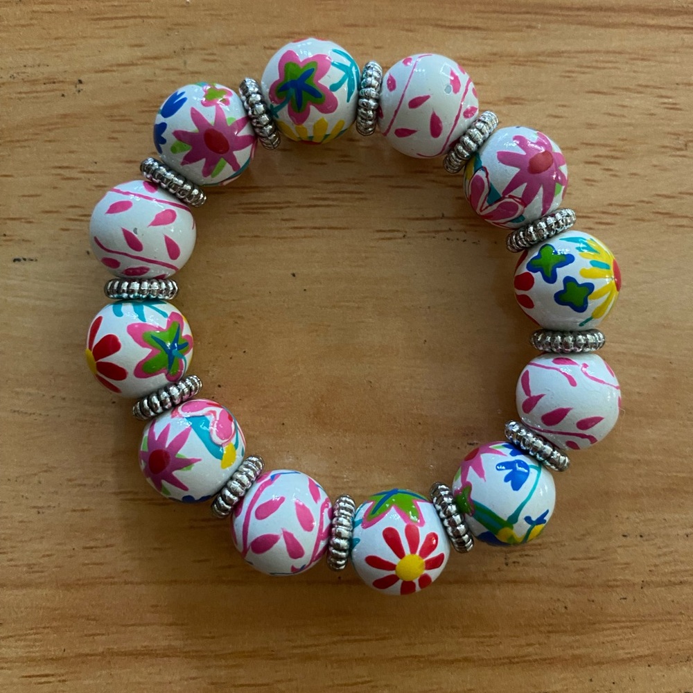 Angela Moore Classic Beaded Bracelet. White with multi colored flowers.
